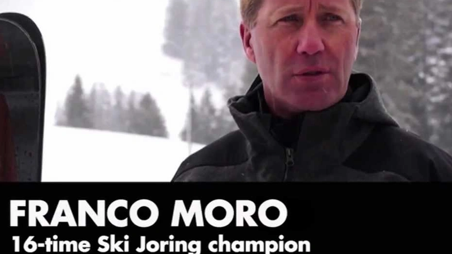 Ski joring champion Franco Moro skiing behind a Bentley Continental GT 2012